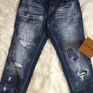 Distressed jeans with flower designs in size 10